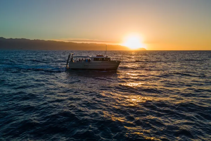 a boat on a body of water next to the ocean